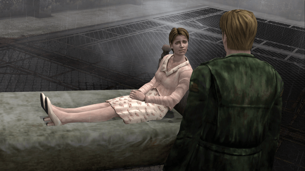 Cutscene de Silent Hill 2. James, o protagonista, conversa com uma memória da sua esposa Mary que está deitada numa cama no topo de um prédio aparentemente abandonado